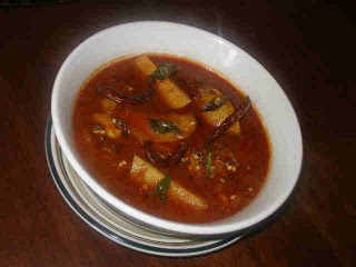 Spiced Potatoes In Tamarind Sauce recipe at DesiRecipes